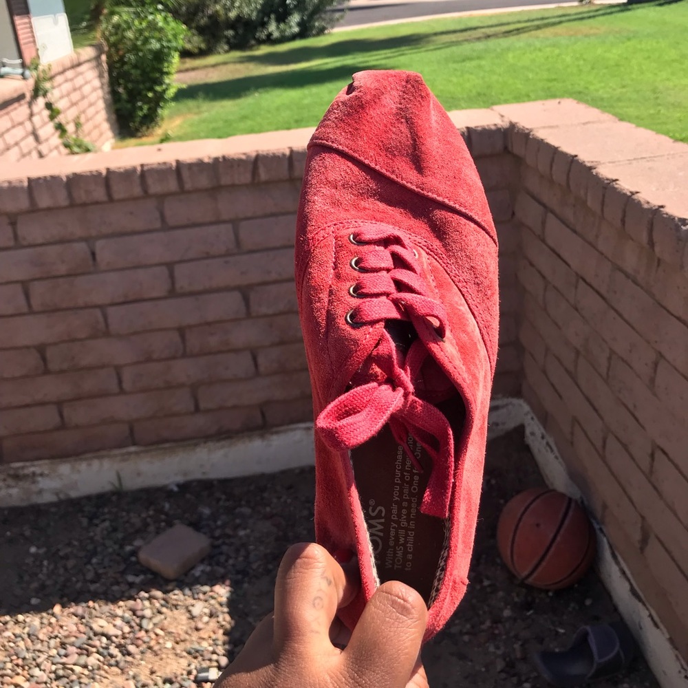 Red TOMS lace up shoes